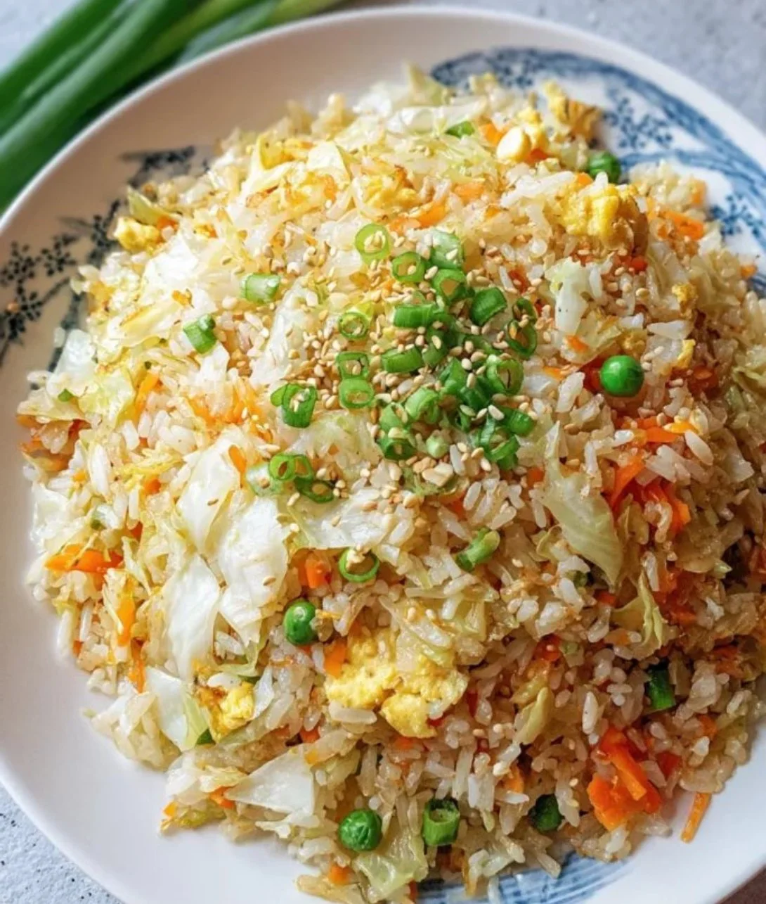 Plate of Cabbage Fried Rice with colorful vegetables and herbs