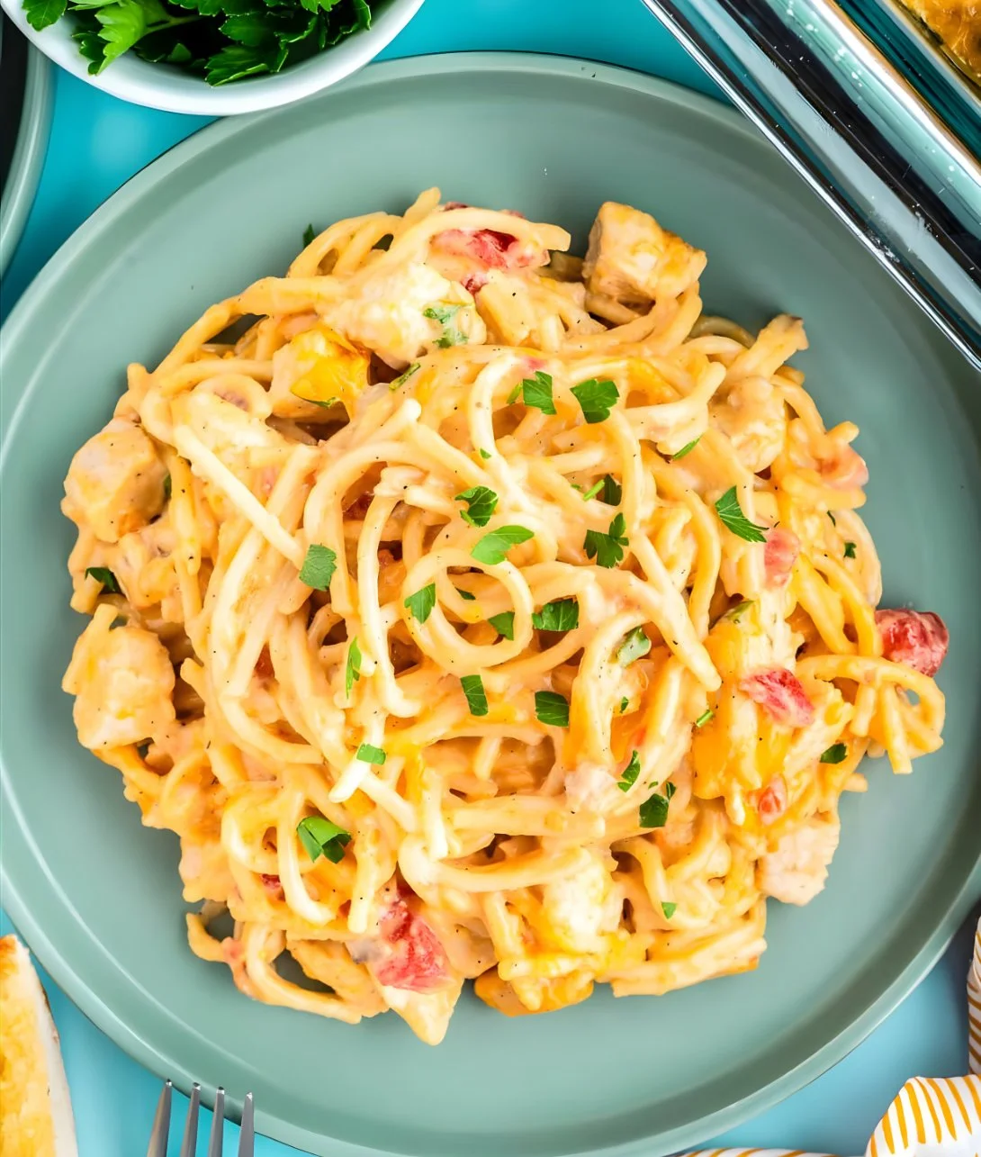 Plate of Chicken Spaghetti with Rotel, featuring pasta, chicken, and tomatoes