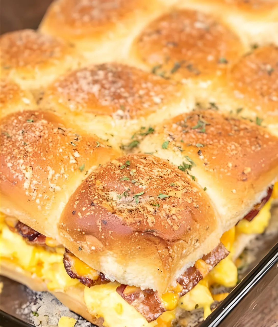 Crack Breakfast Sliders with eggs, cheese, and sausage on a platter