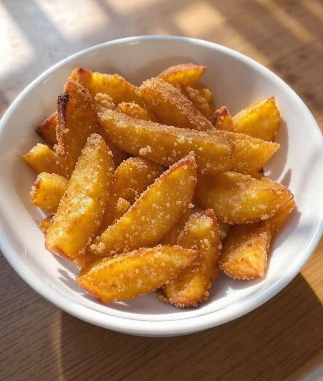 Delicious crispy air fryer apple fries served in a bowl