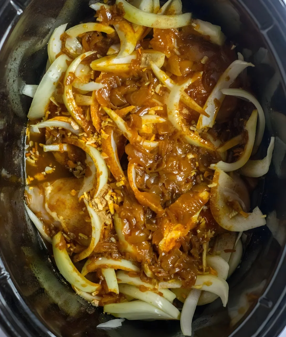 Crockpot French Onion Chicken served with melted cheese and crispy onions