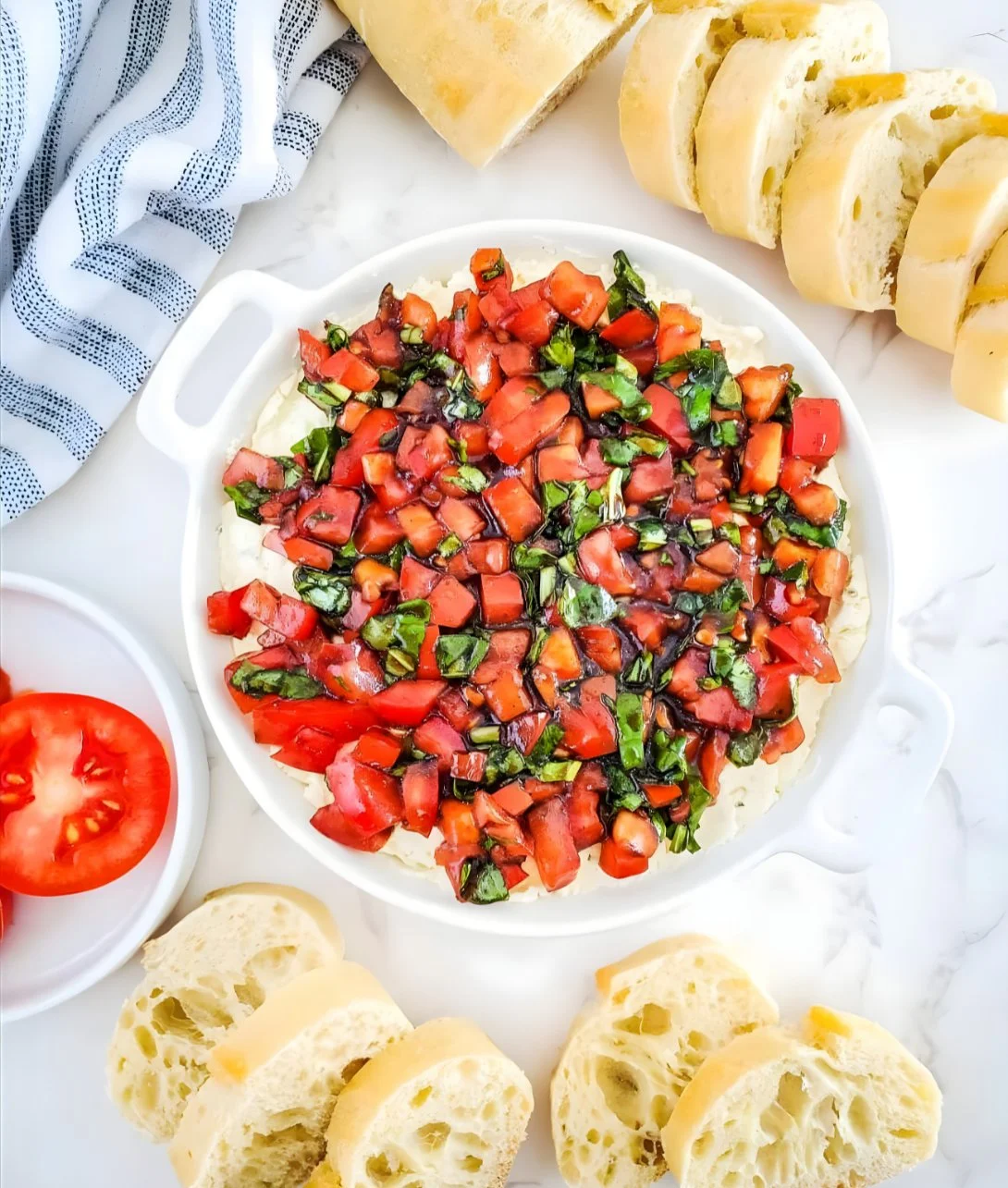Easy Bruschetta Dip served in a bowl with fresh ingredients and toasted bread