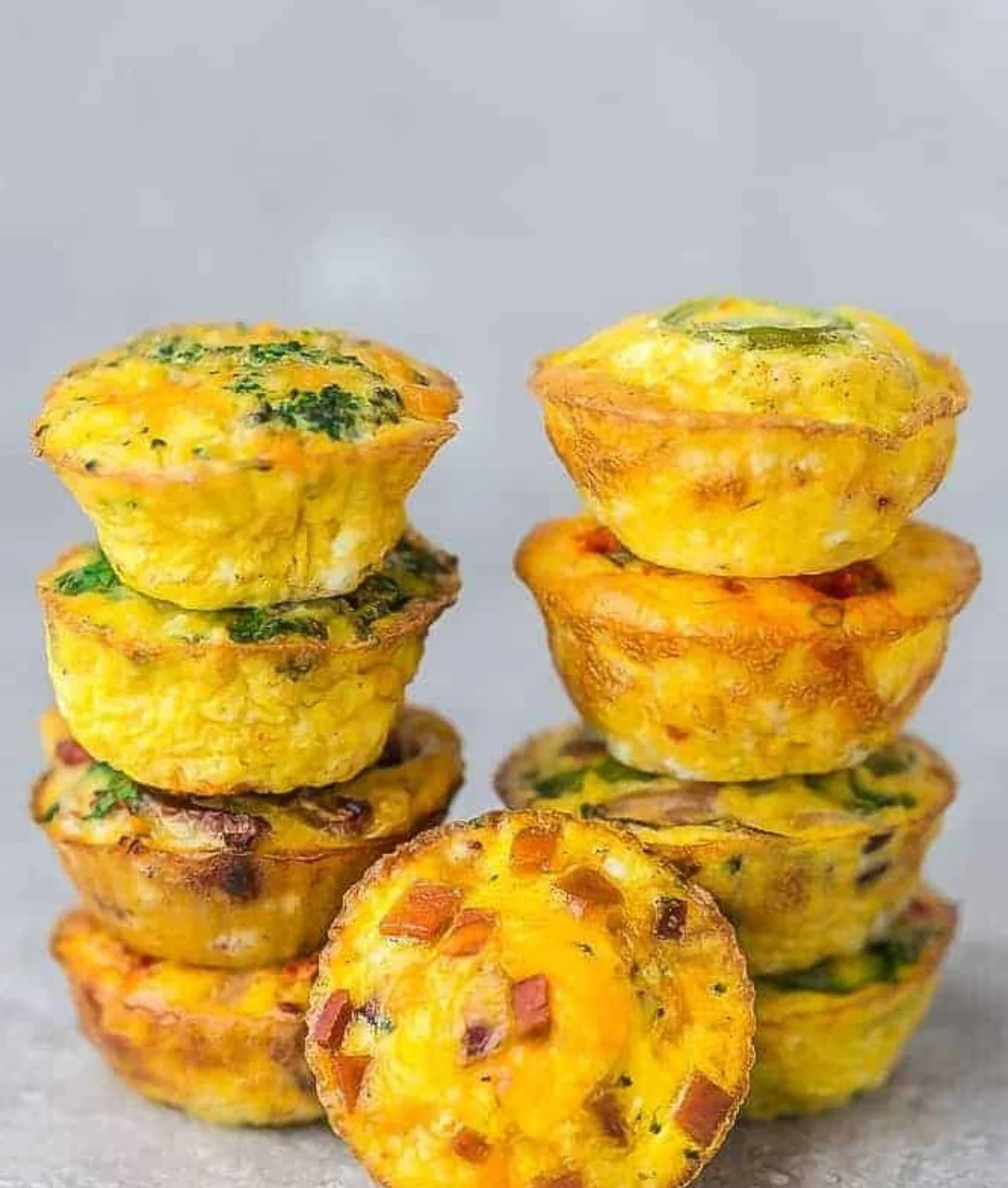 Homemade egg muffins with vegetables and cheese, perfect for breakfast.