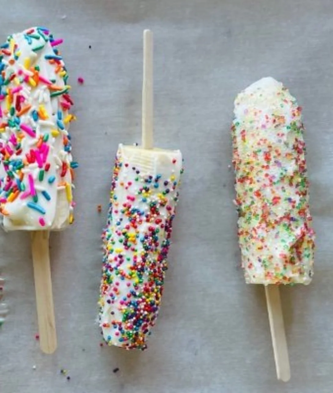 Delicious frozen banana yogurt pops on a wooden stick