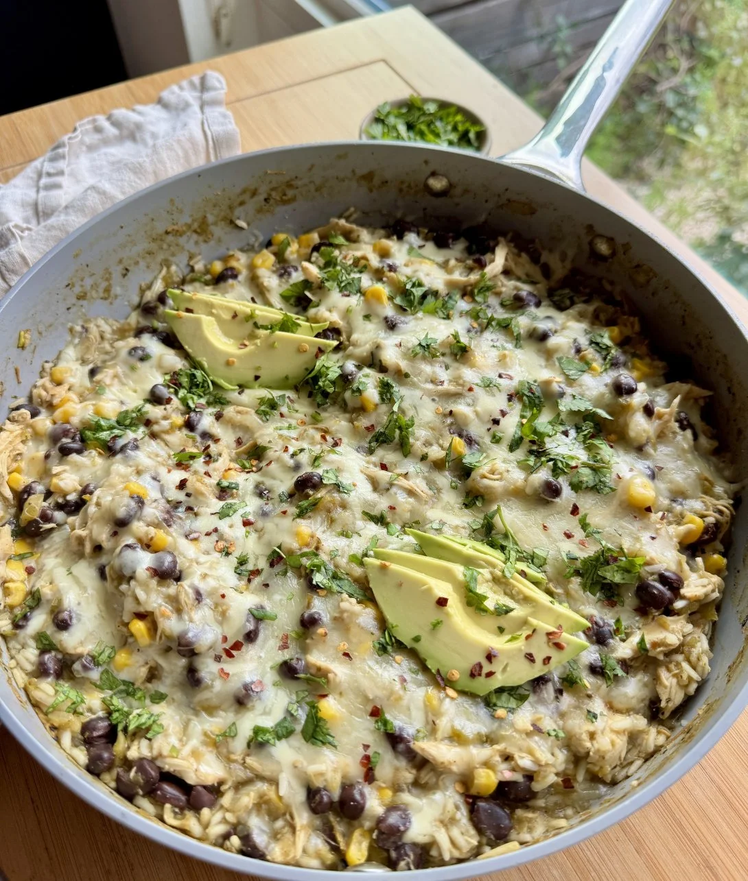 Delicious Green Sauce Chicken & Rice Skillet served in a cast iron pan