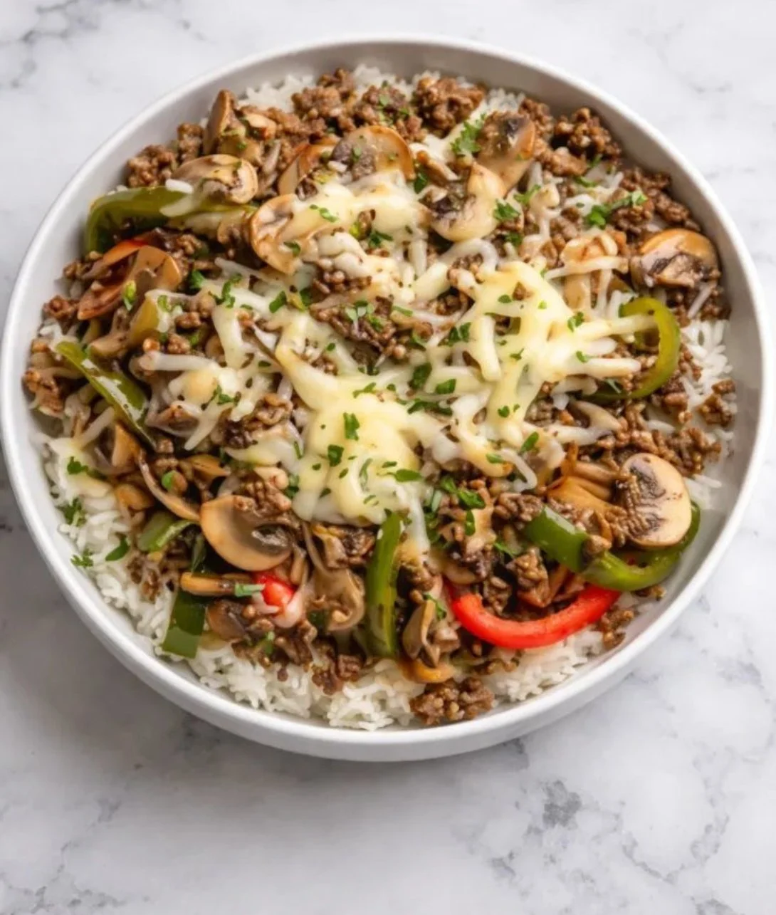 Ground Beef Philly Cheesesteak meal prep with cheese and peppers in a container
