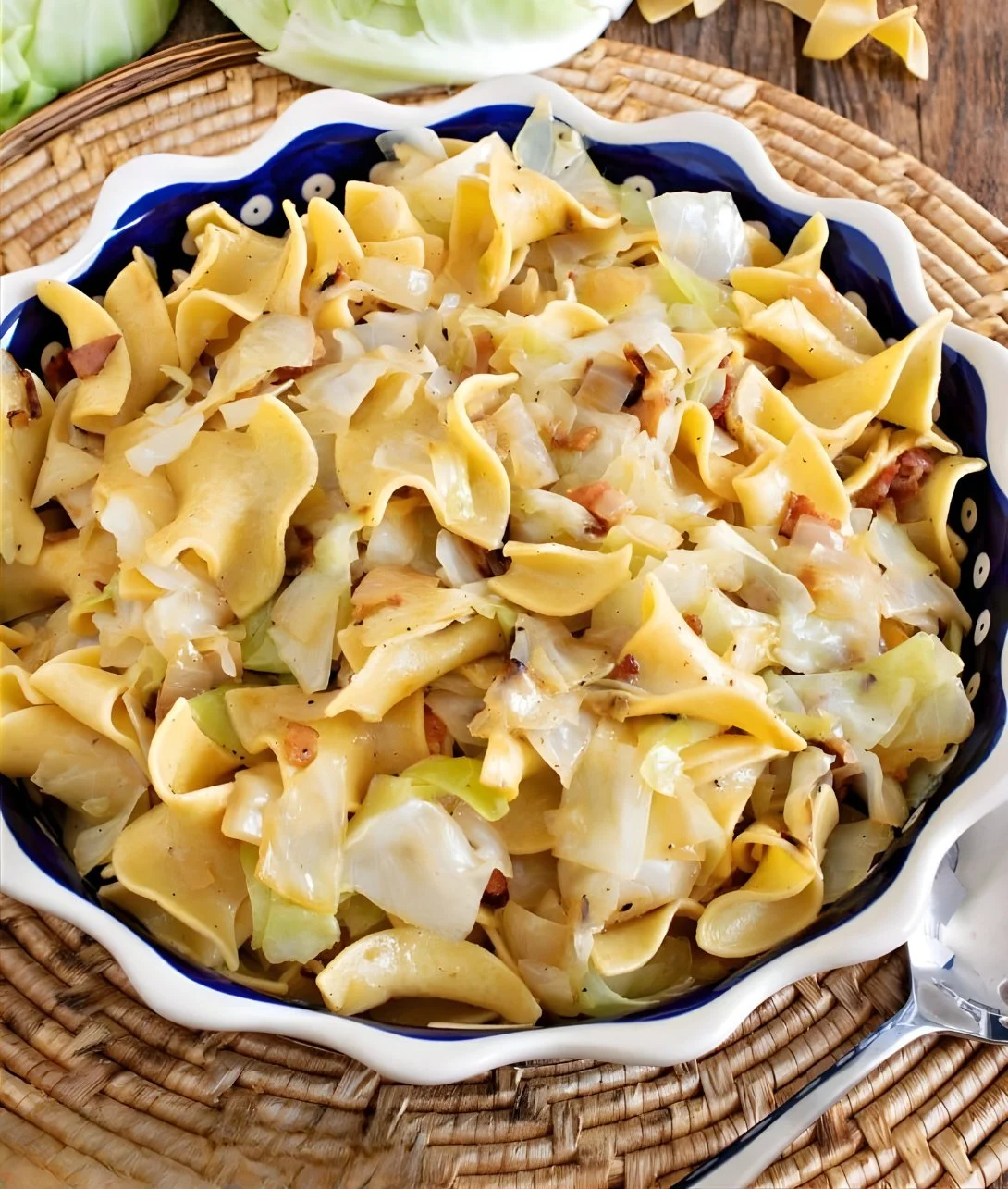 Plate of Haluski with fried cabbage and noodles served in a bowl.