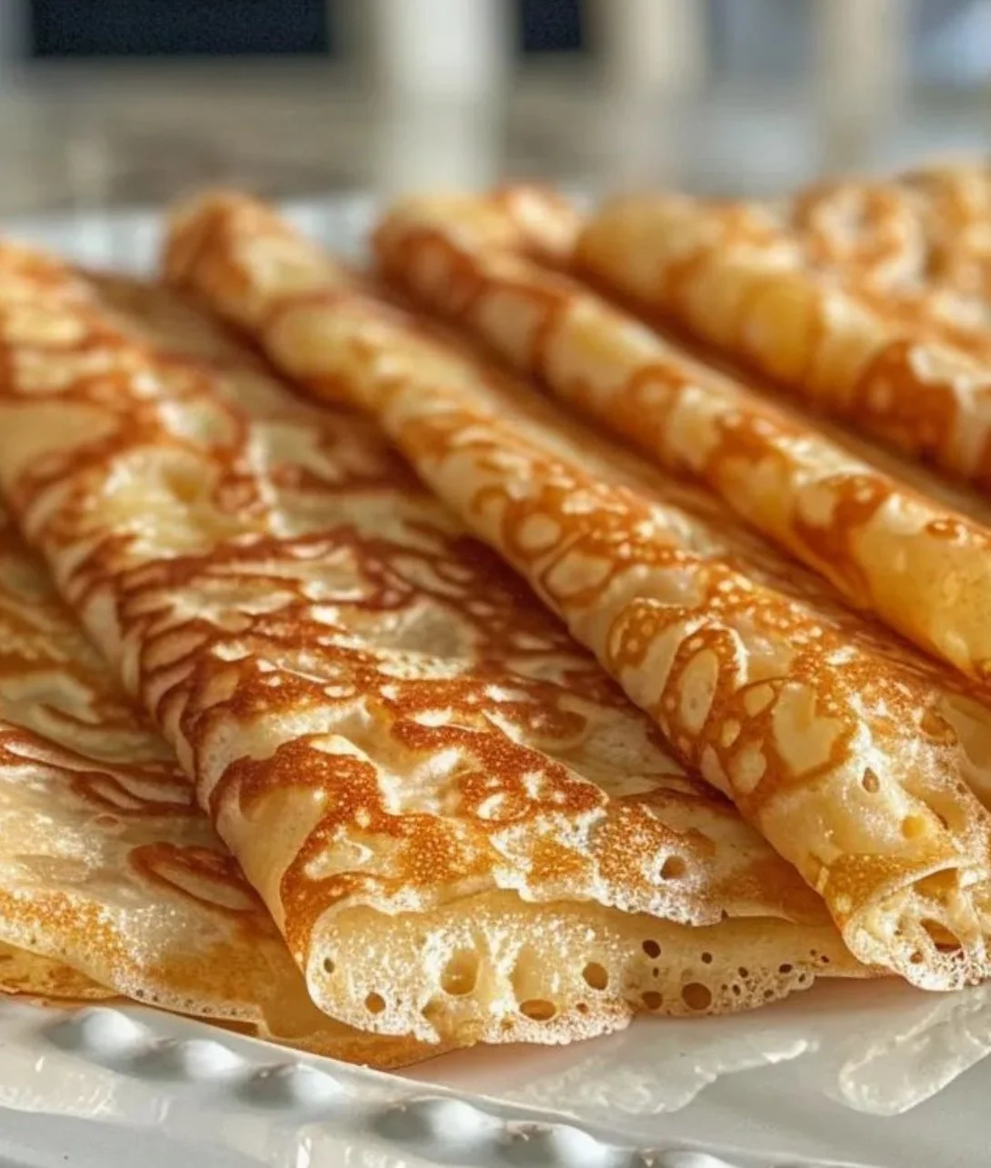 Delicious oatmeal crepes topped with fresh fruits and syrup