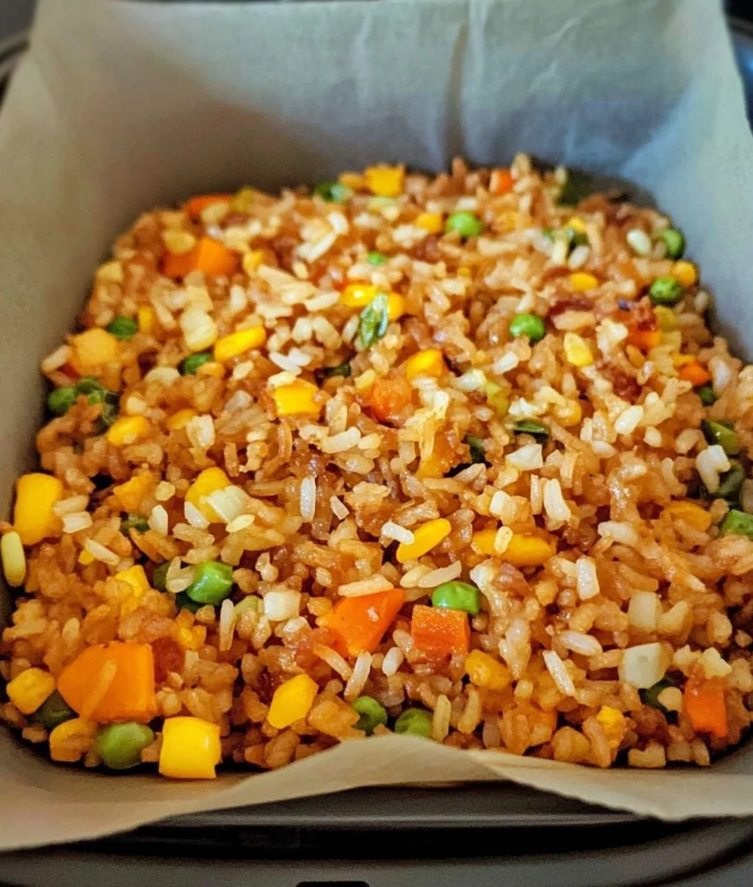 Delicious air fryer fried rice served in a bowl with colorful vegetables
