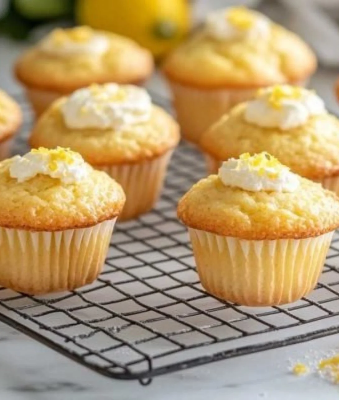Delicious Keto Lemon Cream Cheese Muffins on a plate with lemon slices