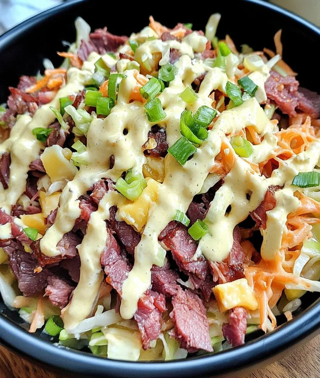 Delicious Keto Reuben in a Bowl with corned beef, cheese, and sauerkraut