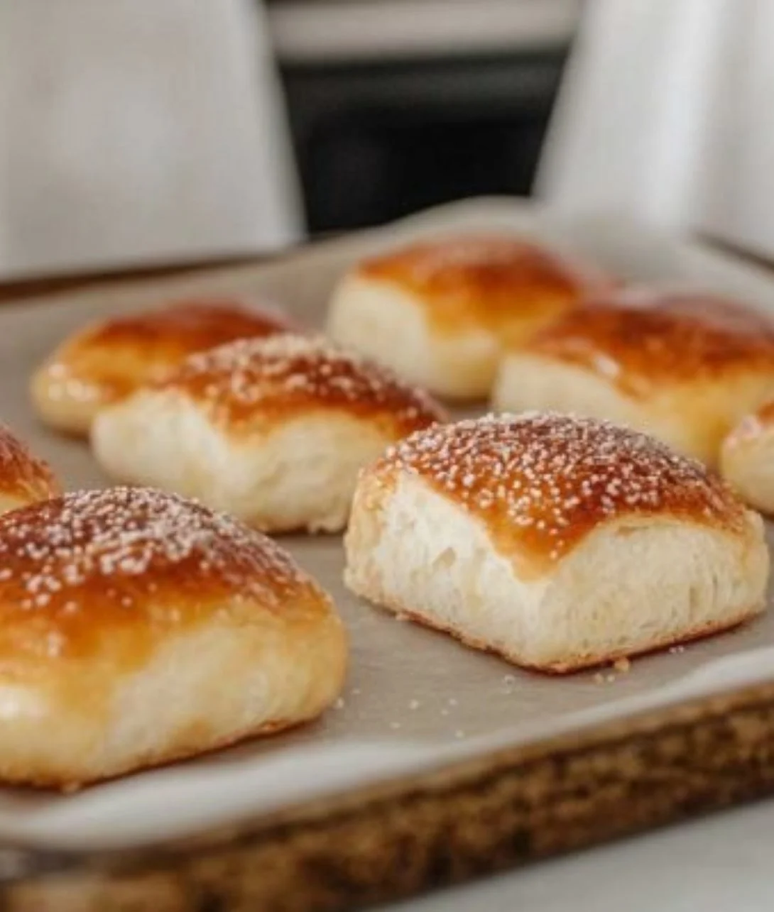 Freshly baked keto soft pretzel bread on a wooden table