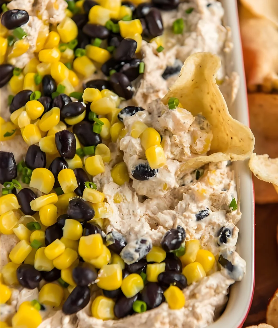 Delicious Loaded Cream Cheese Dip with toppings served in a bowl