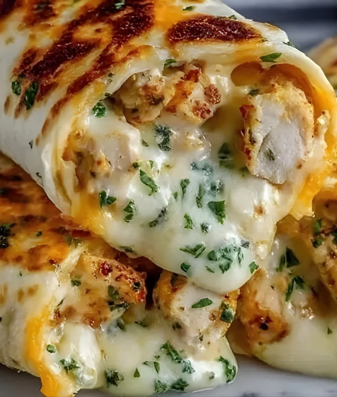 Low Carb Cheesy Garlic Chicken Wraps ready to serve on a plate.