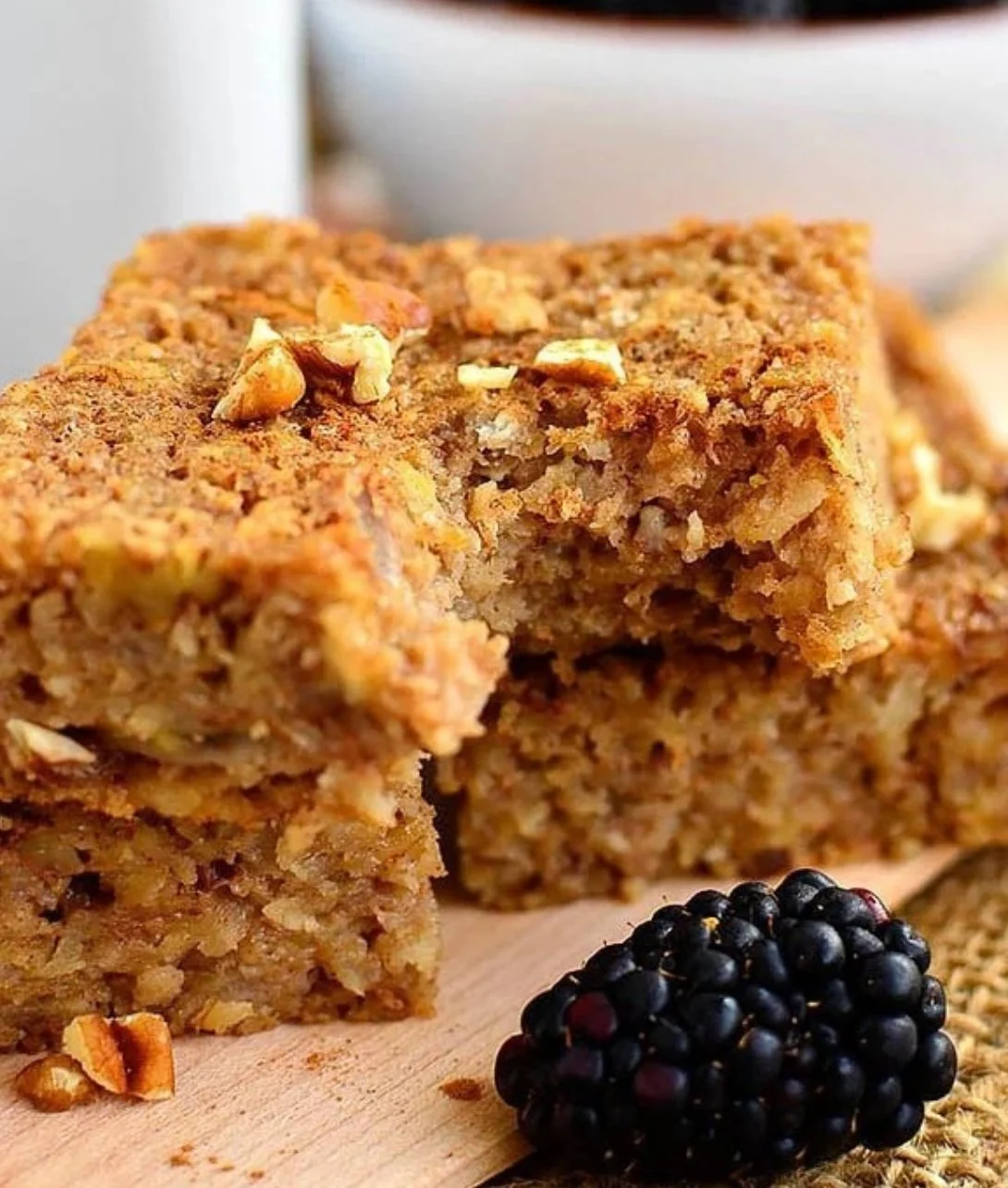 Maple cinnamon oatmeal breakfast bars on a wooden table