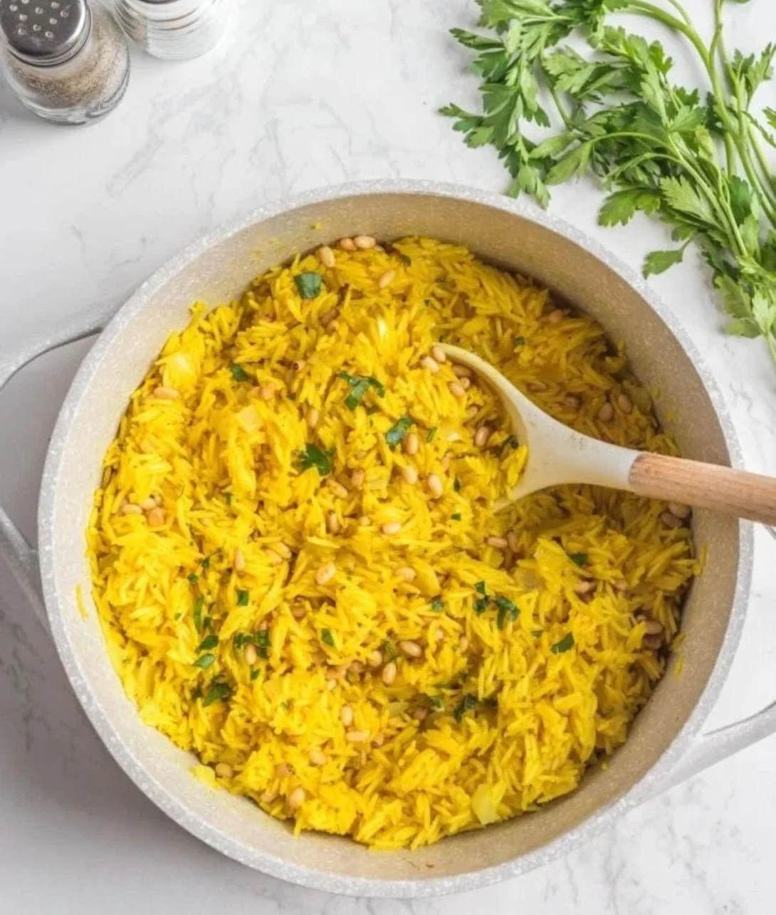 A bowl of Mediterranean rice with fresh vegetables and herbs