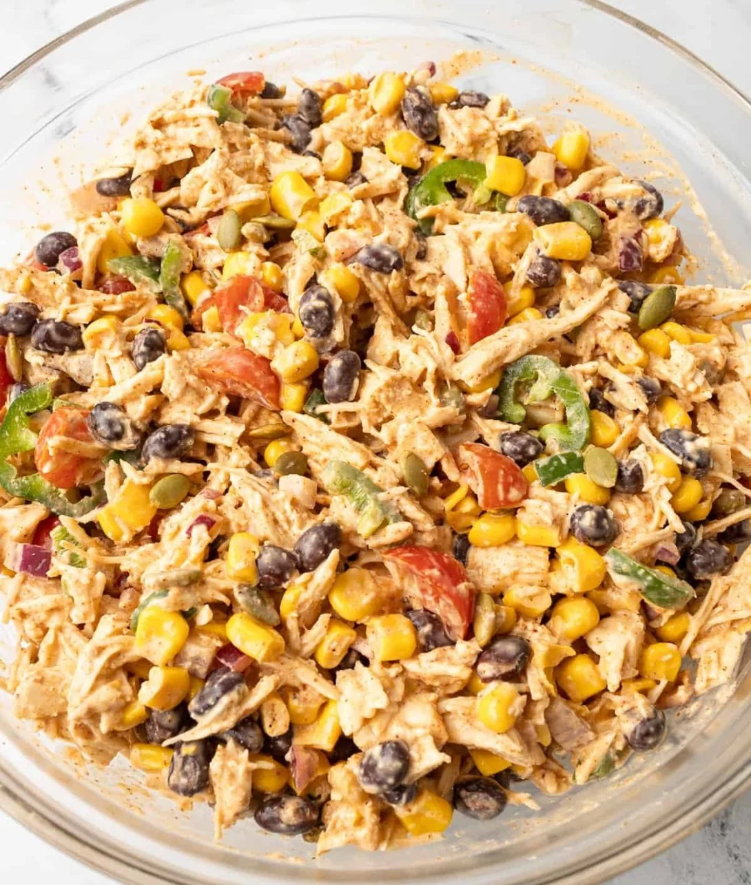 Colorful and fresh Southwest Chicken Salad with grilled chicken, veggies, and dressing