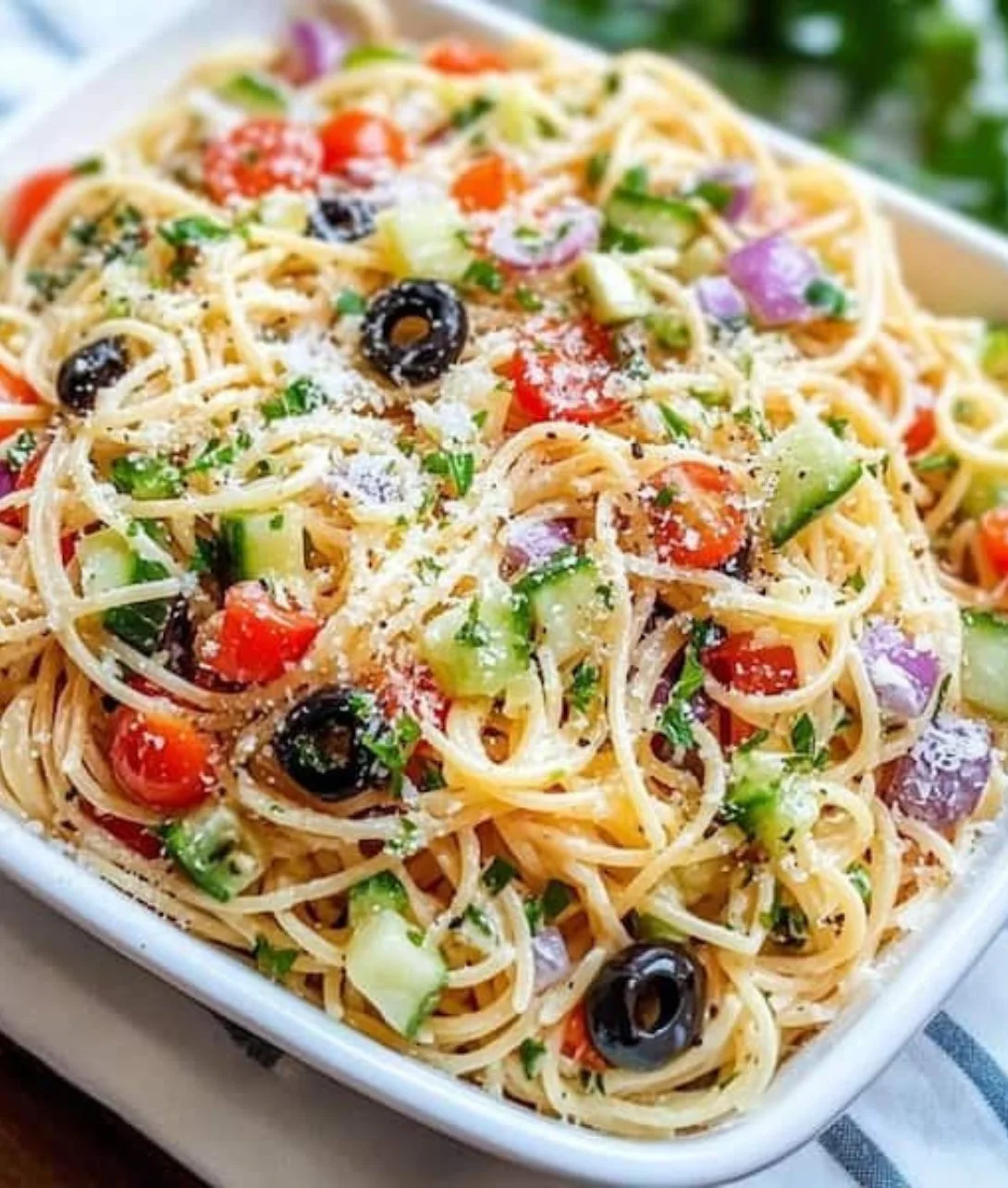 Quick spaghetti salad with Italian dressing in a colorful bowl