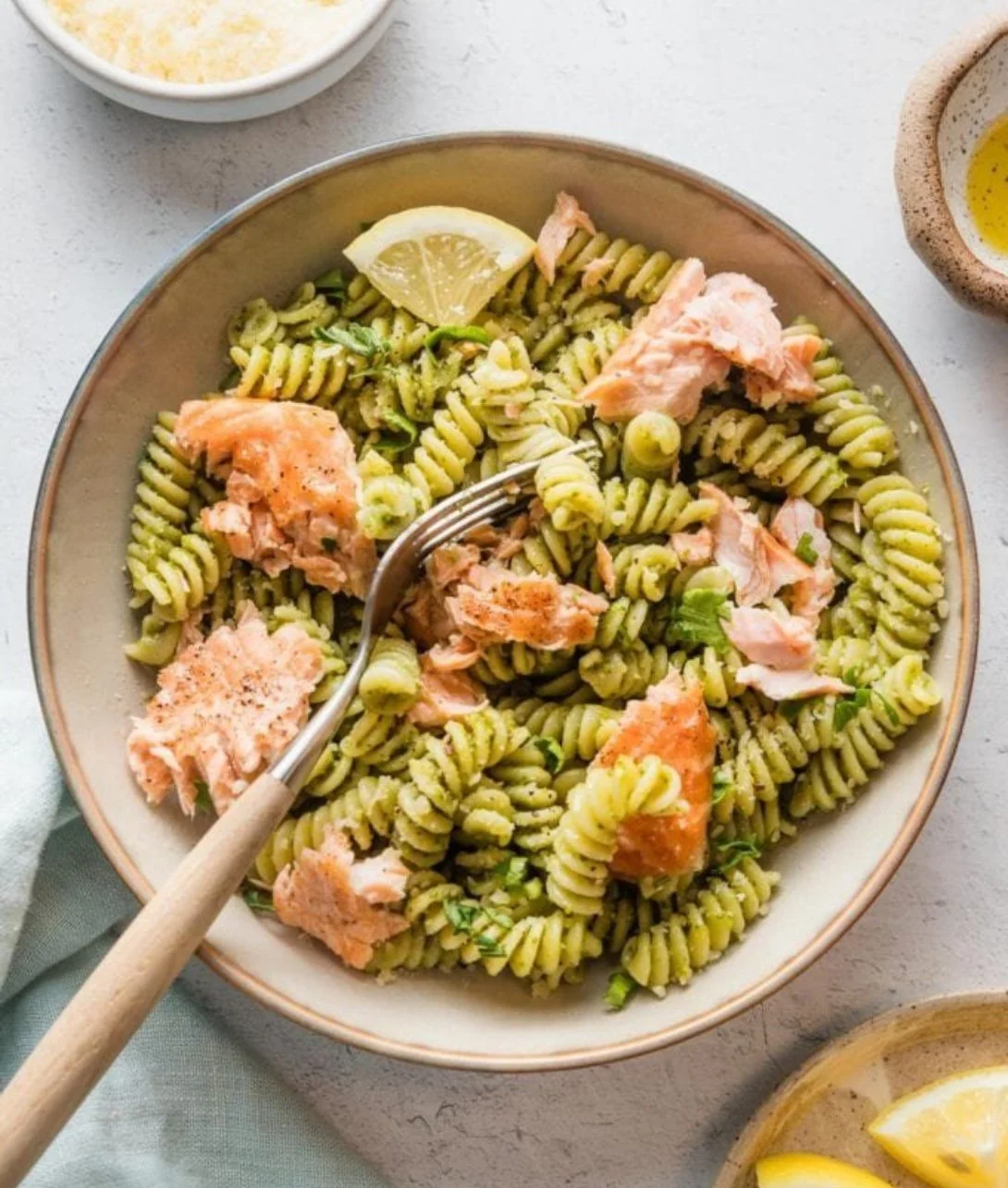 Delicious Salmon Pesto Pasta served with fresh herbs and pasta