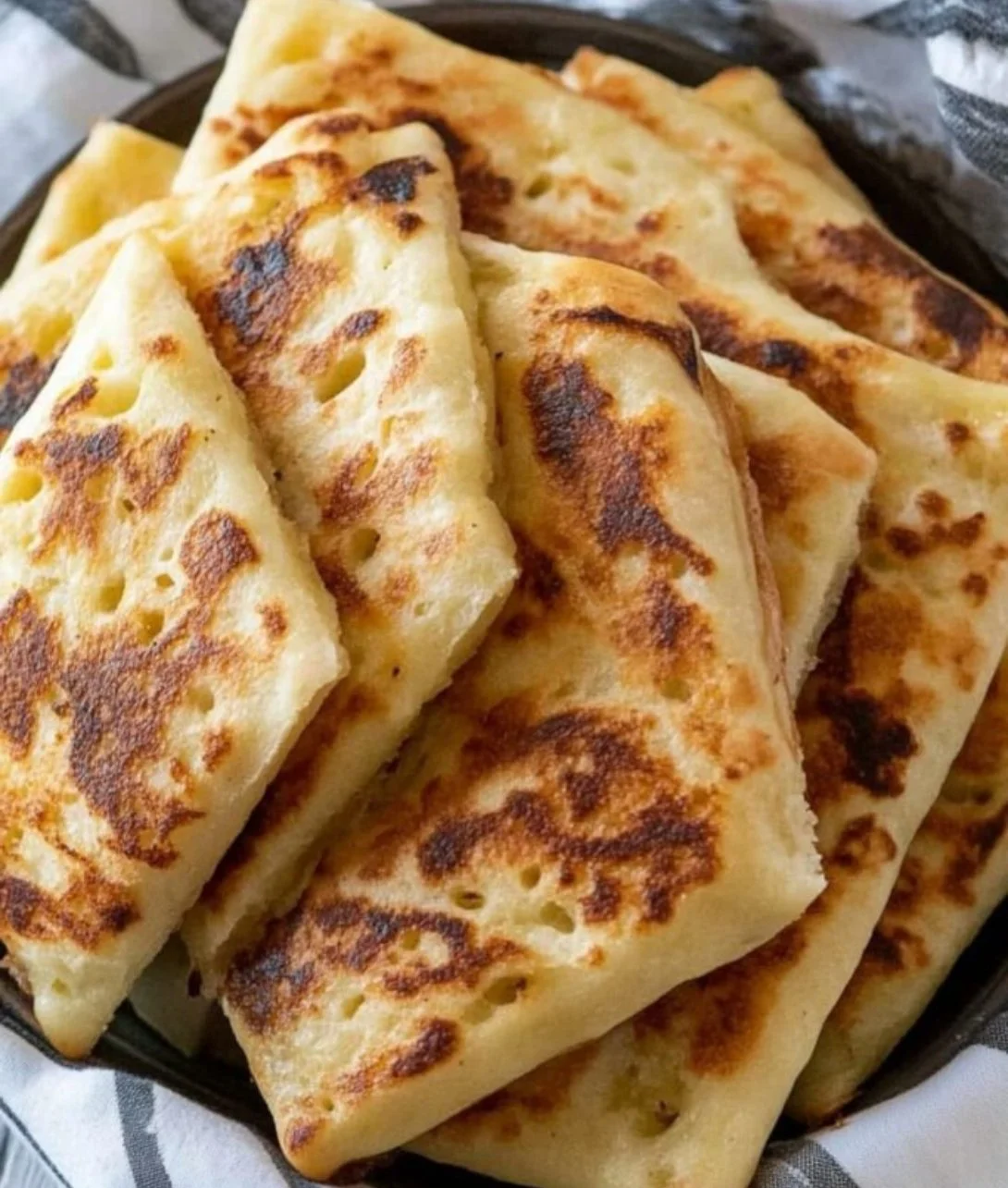 Freshly baked Irish potato bread on a wooden table.