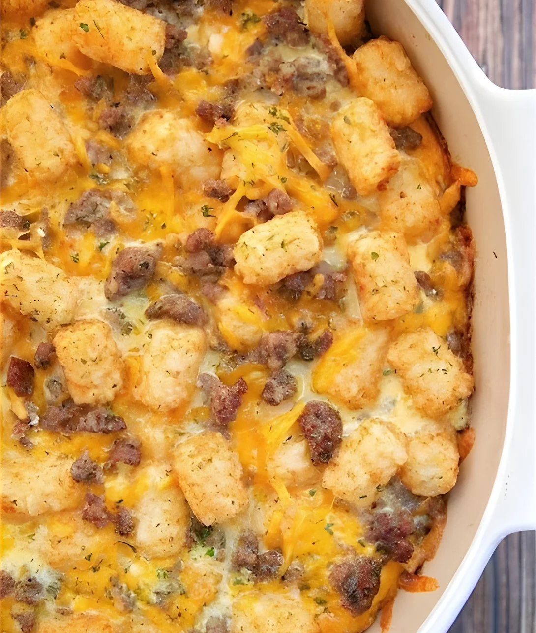 Tater Tot Sausage Breakfast Casserole baked and ready to serve in a casserole dish.