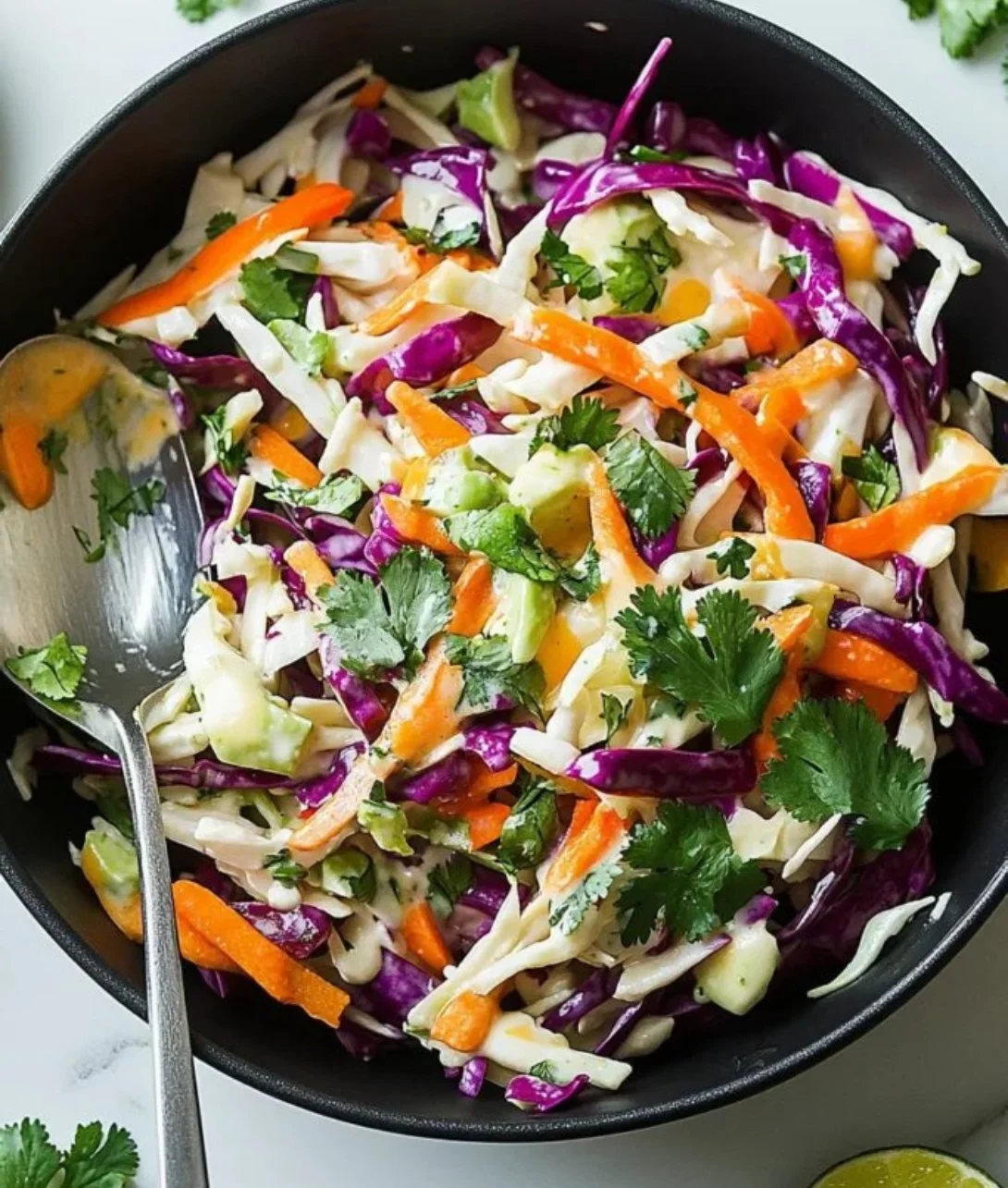 Zesty Mexican coleslaw with cilantro served in a bowl