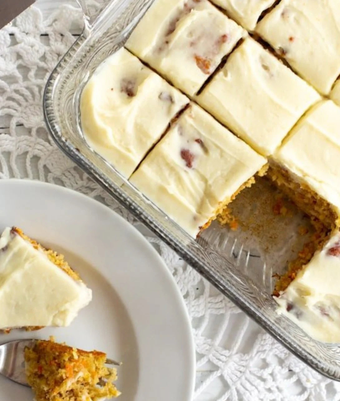 Almond Flour Carrot Cake topped with cream cheese frosting and walnuts