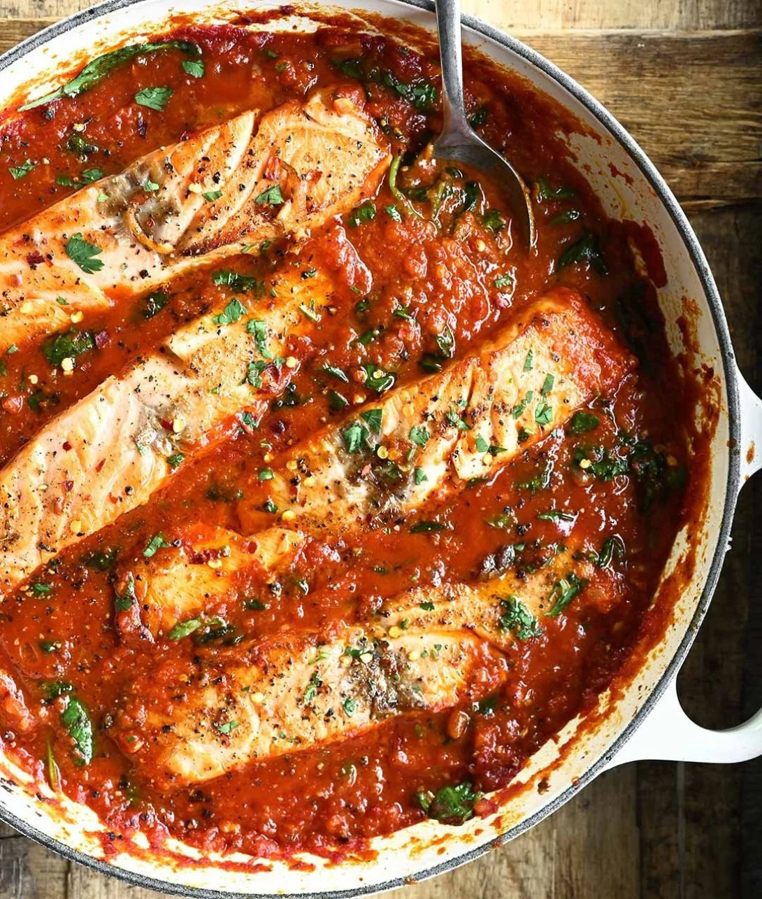 An illustration of the Angry Salmon swimming fiercely in a river