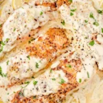 Baked Boursin Salmon topped with herbs and served on a plate