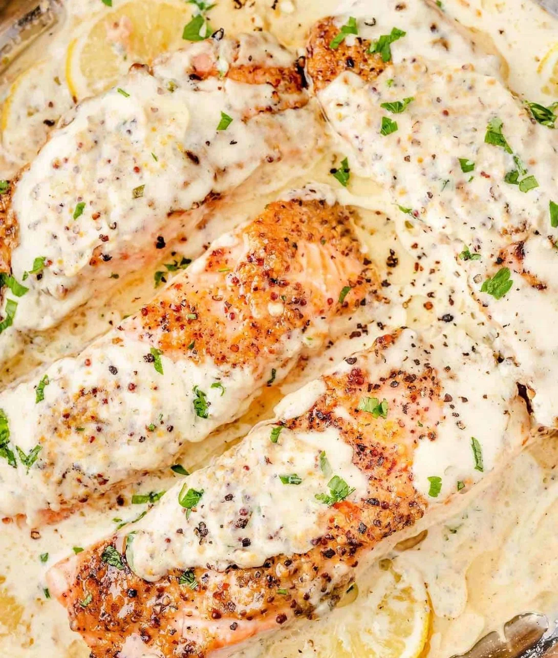 Baked Boursin Salmon topped with herbs and served on a plate