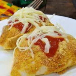Baked chicken stuffed peppers filled with seasoned chicken and colorful vegetables.