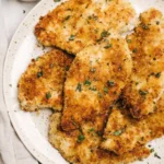 Baked Parmesan Crusted Chicken served with a side of fresh vegetables