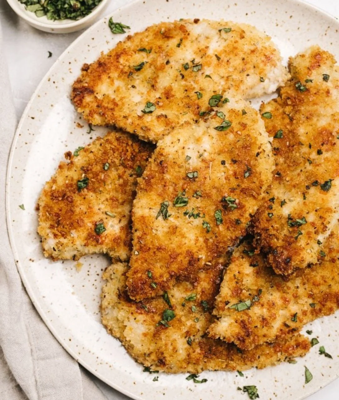 Baked Parmesan Crusted Chicken served with a side of fresh vegetables