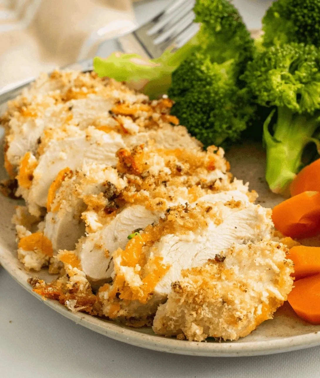 Baked ranch chicken garnished with herbs on a plate