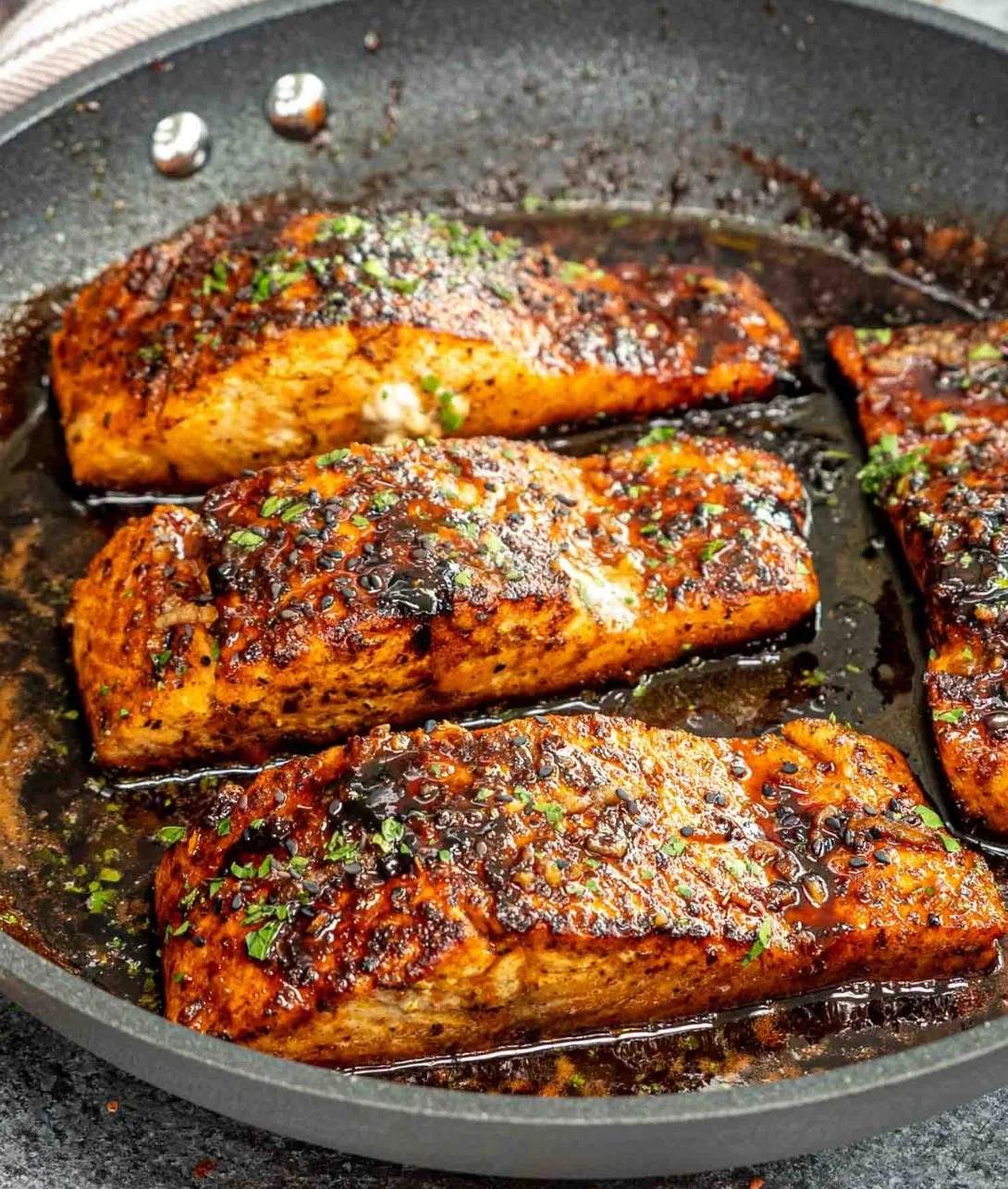 Delicious Cajun Honey Butter Salmon garnished and served on a plate.