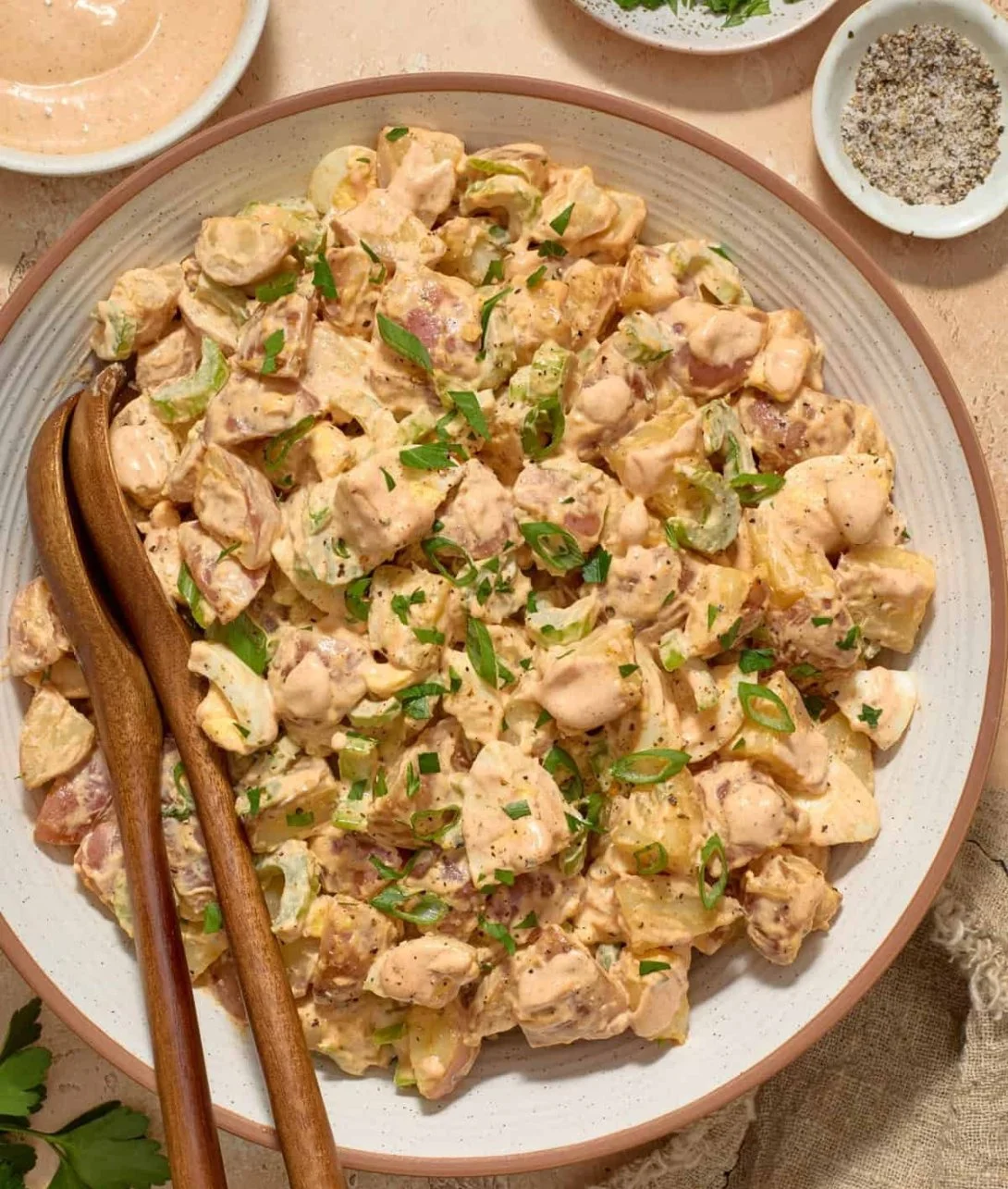 Delicious Cajun Potato Salad garnished with herbs and spices