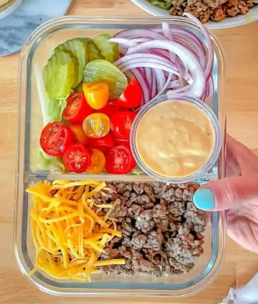Delicious cheeseburger bowls with toppings and ingredients