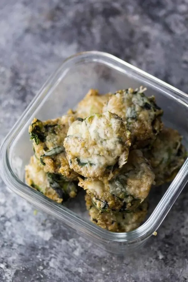 Cheesy spinach quinoa cups baked to perfection, a healthy snack option.