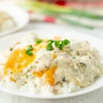 Delicious Chicken Olivia dish served with vibrant vegetables and herbs