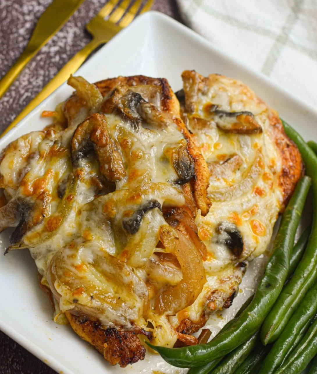 Delicious smothered chicken served with savory toppings inspired by Texas Roadhouse.