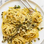A plate of easy 20 minute lemon garlic pasta garnished with fresh parsley.