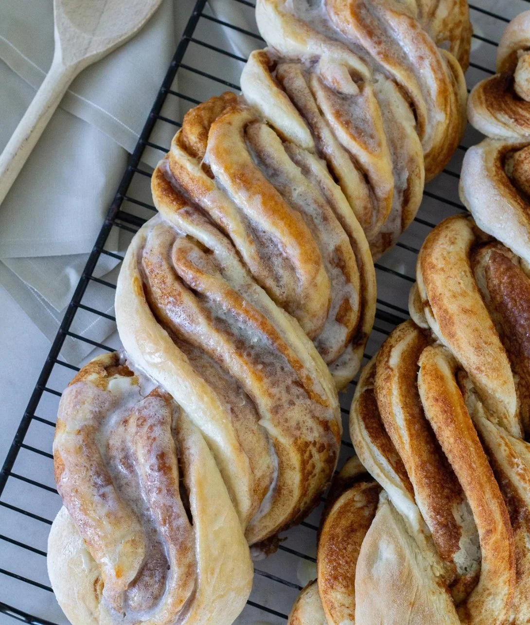 Freshly baked cinnamon twist loaf with a golden brown crust and swirls of cinnamon.