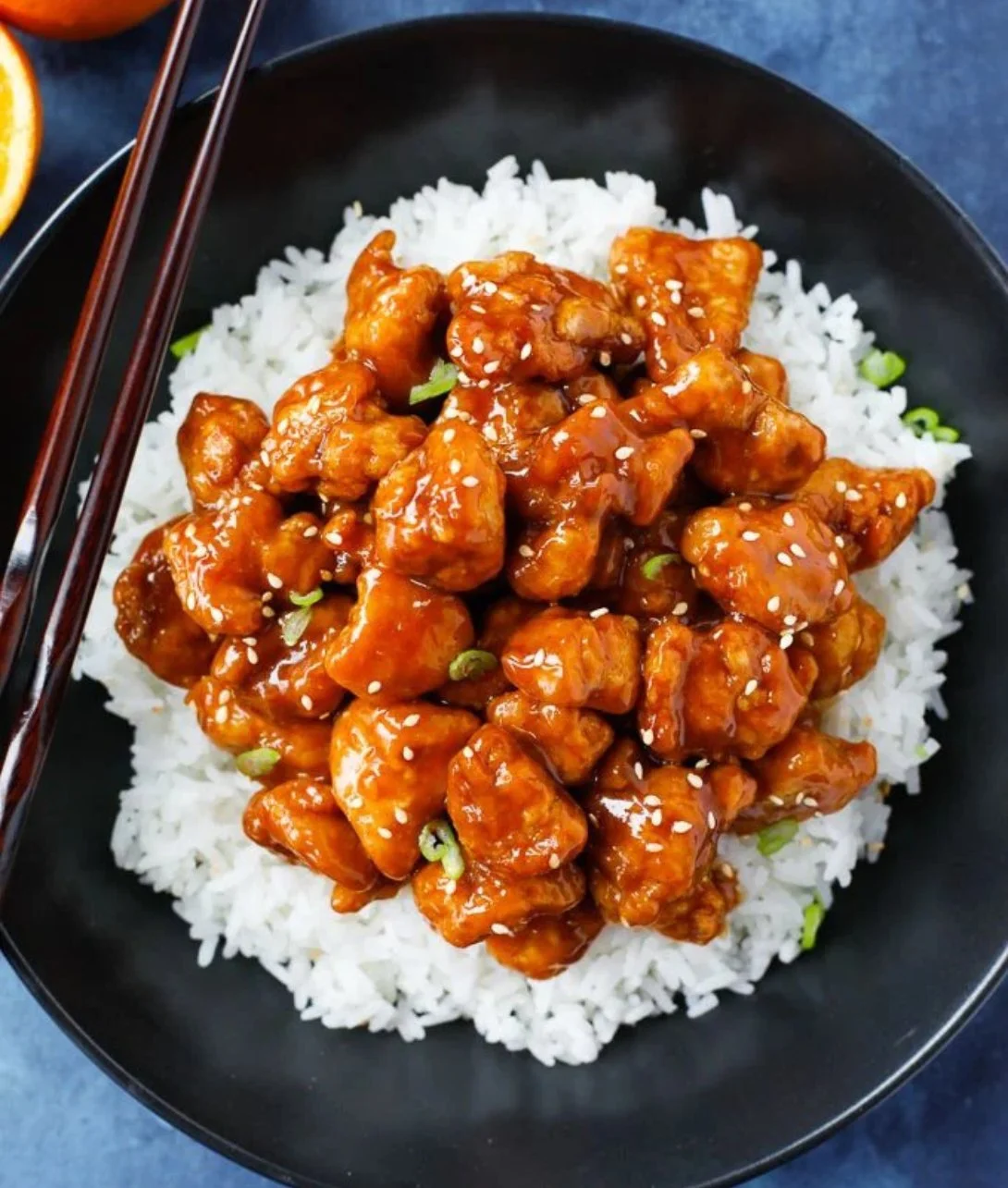Delicious plate of easy orange chicken with rice and vegetables
