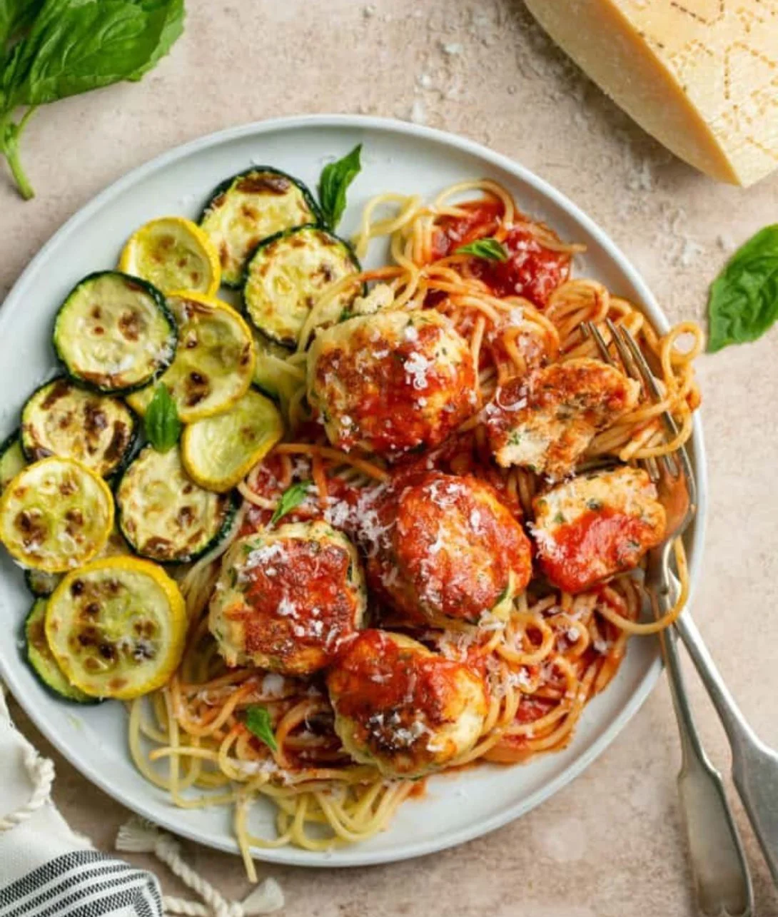 Healthy turkey ricotta meatballs served in a bowl with fresh herbs