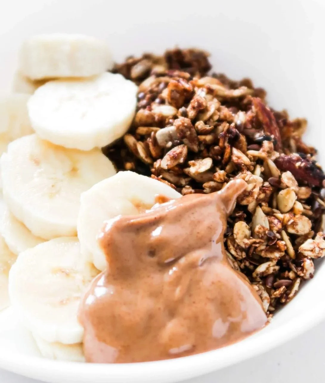 Bowl of homemade healthy granola with nuts and dried fruits.