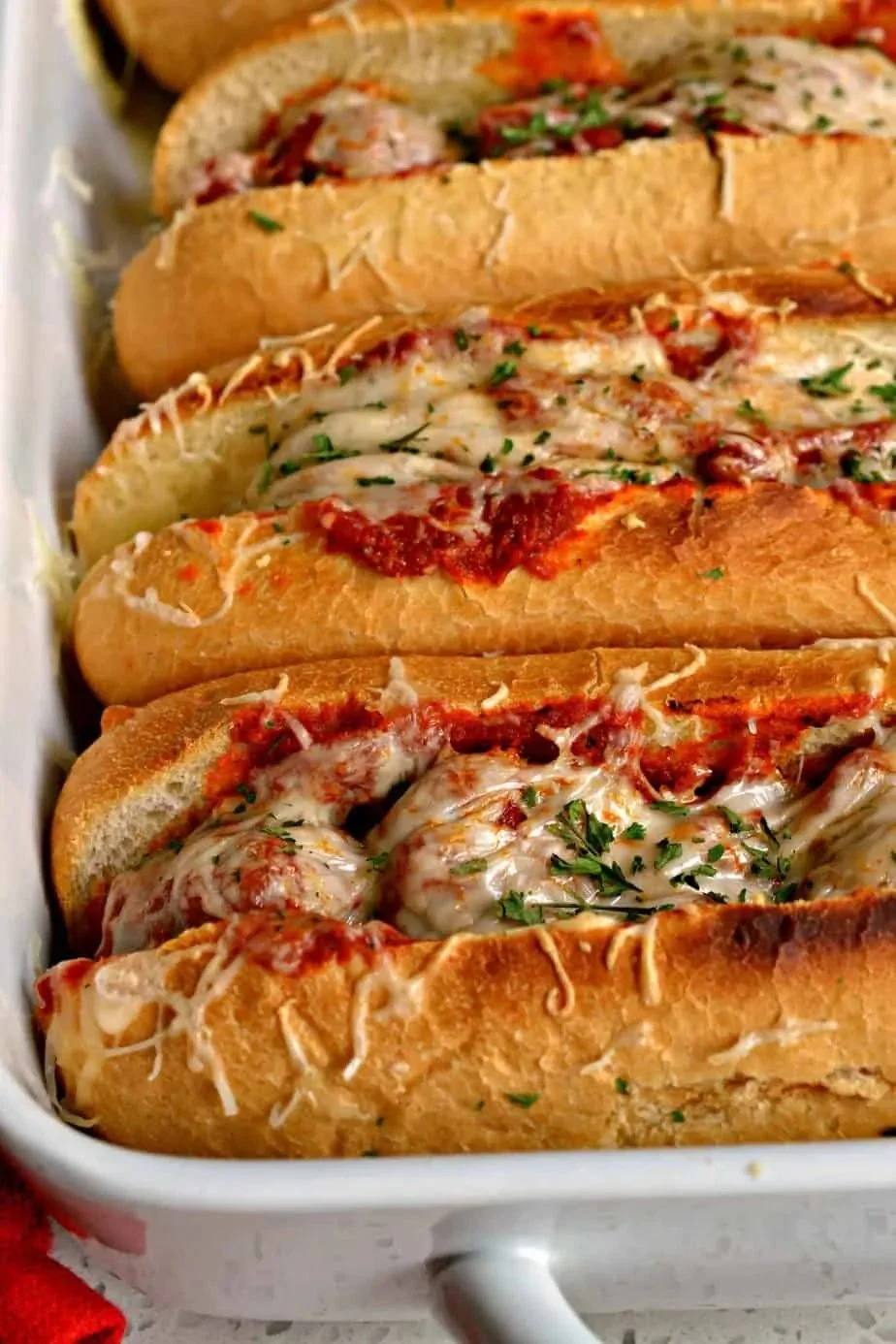 Italian meatball subs with marinara sauce and melted cheese in a sub roll
