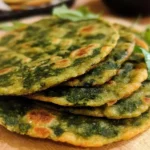 Delicious homemade lentil spinach flatbread on a wooden board