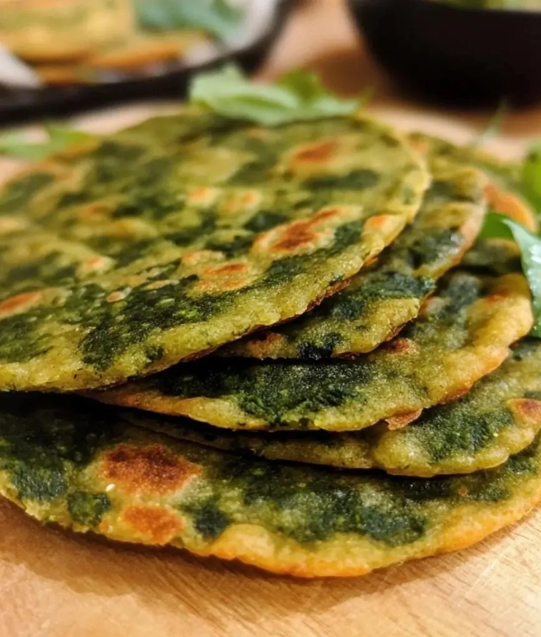 Delicious homemade lentil spinach flatbread on a wooden board