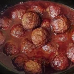 Plate of low carb slow cooker meatballs served with sauce