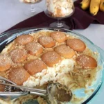 Delicious Magnolia Bakery banana pudding in a clear dish topped with vanilla wafers